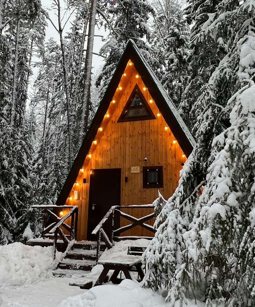 A frame cabin in snow