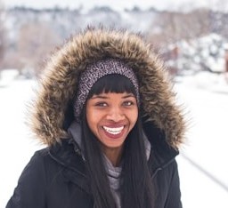 lady in black coat smiling