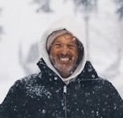 man in snow smiling
