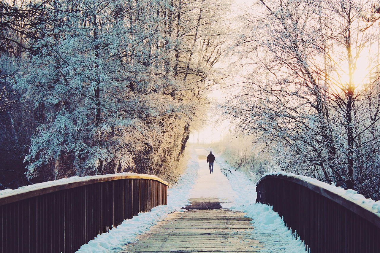 man walking in snow