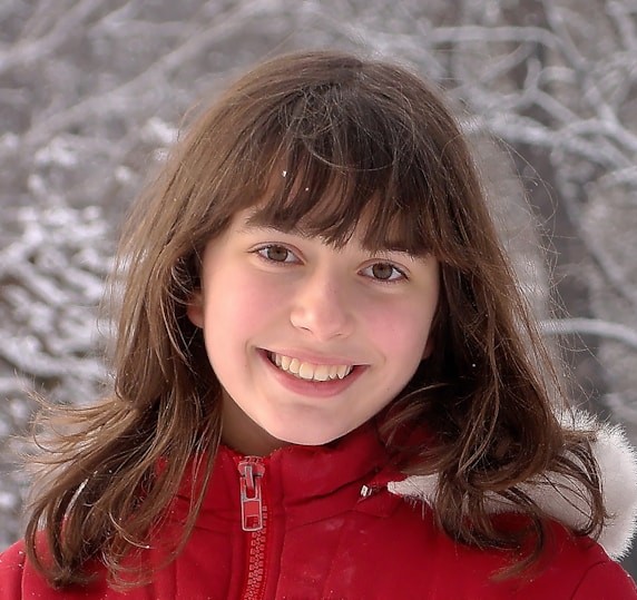 woman in red jacket smiling