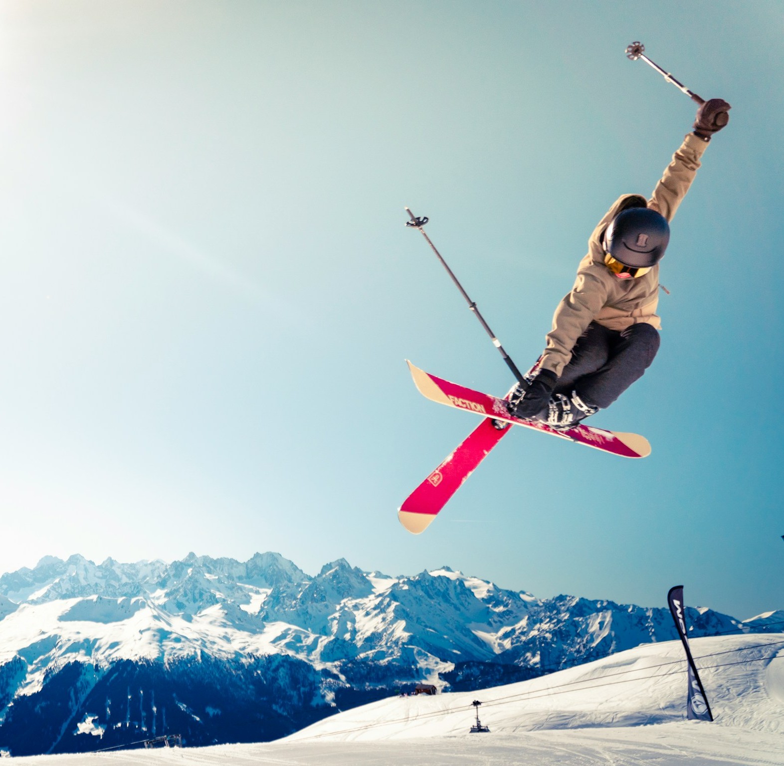 A skiier doing a jump