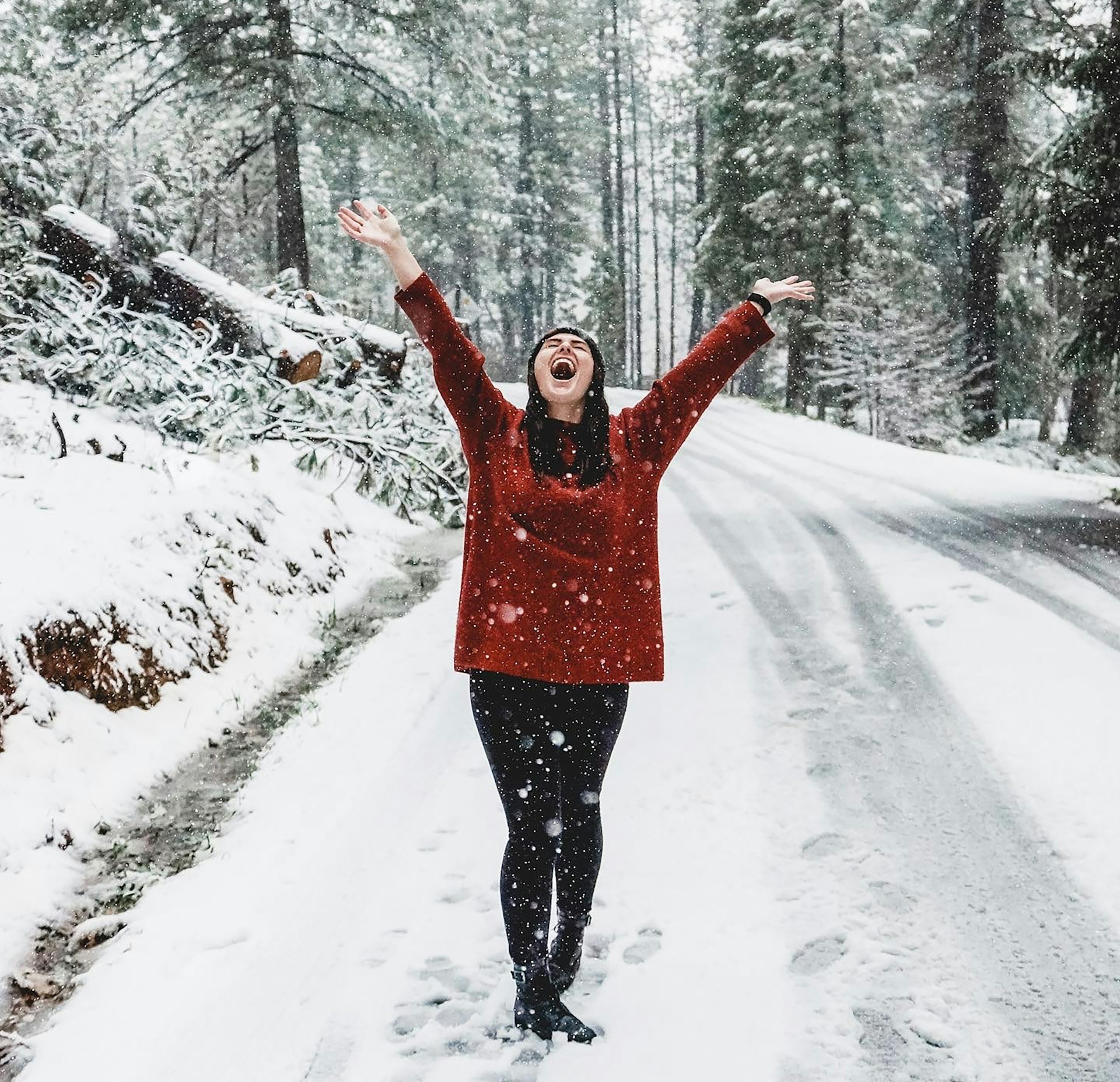 A woman happy in the snow